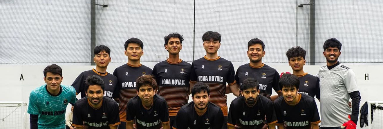 Nova Royals team in black jerseys indoors